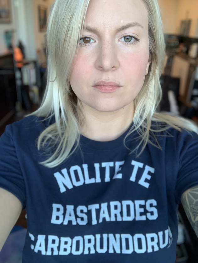 Photo of Gjovik wearing tshirt that says don't let the bastards grind you down